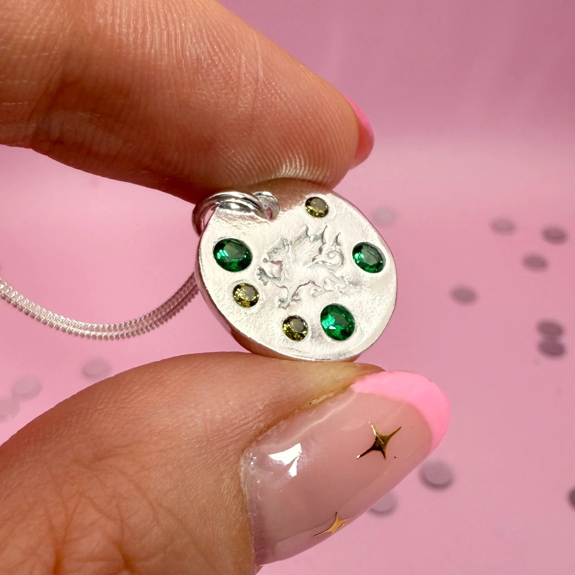 Welsh dragon silver pendant displayed on jewellery box, unique handmade Welsh gift.