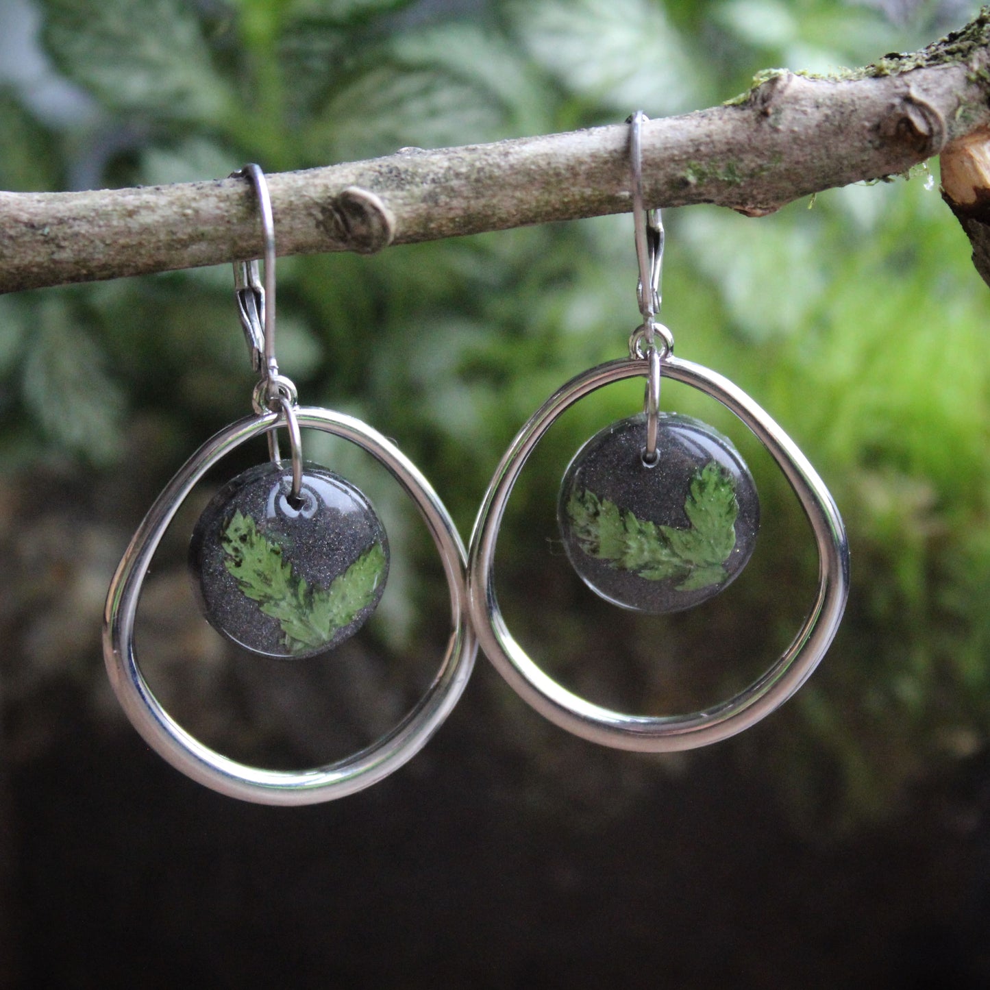 Silver hoop earrings with green stone drops on a branch. Perfect gift for jewellery lovers, sustainable style seekers, or anyone who loves bold, handmade accessories