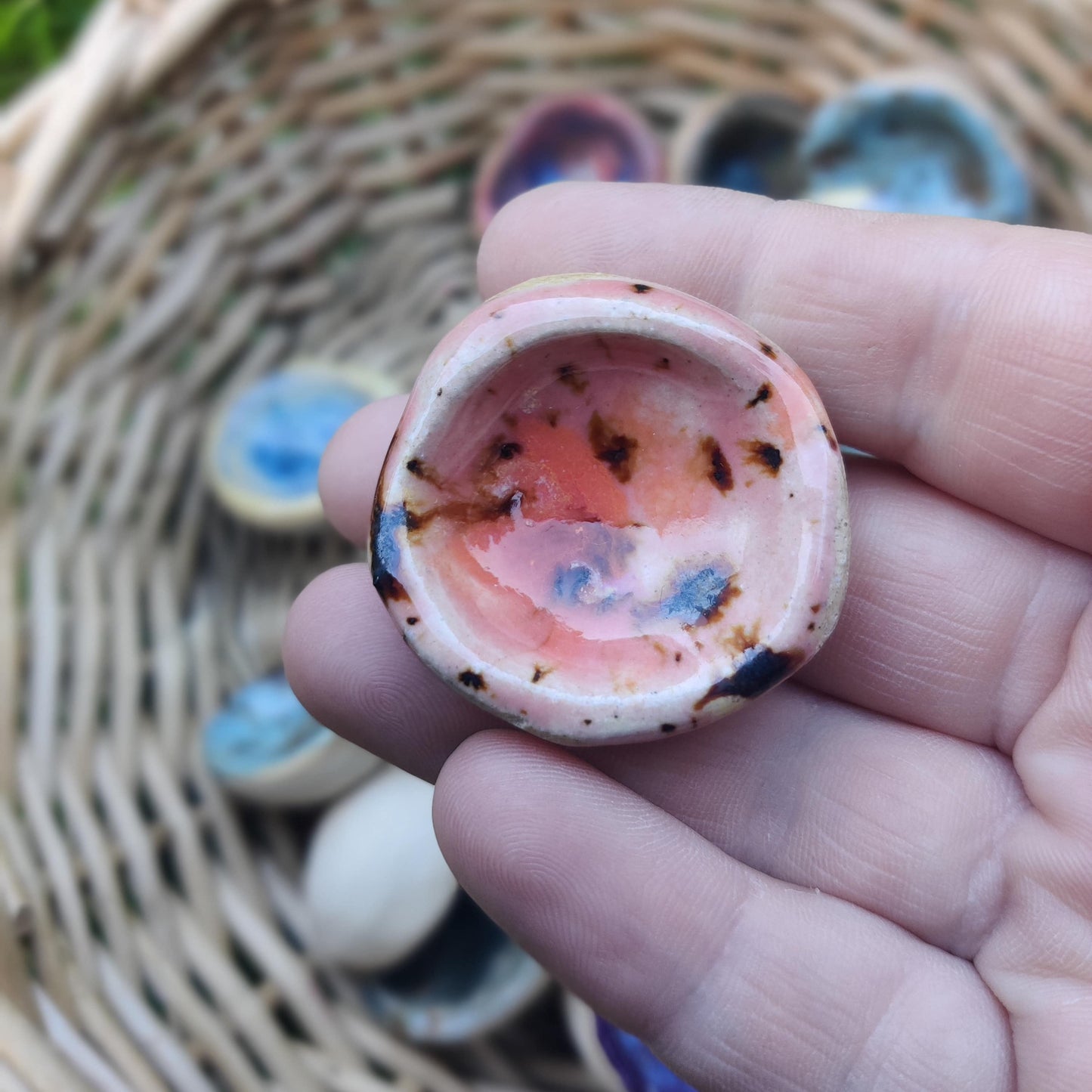 Handmade ceramic worry stone in an apricot glaze, designed to support mindfulness and ease stress.