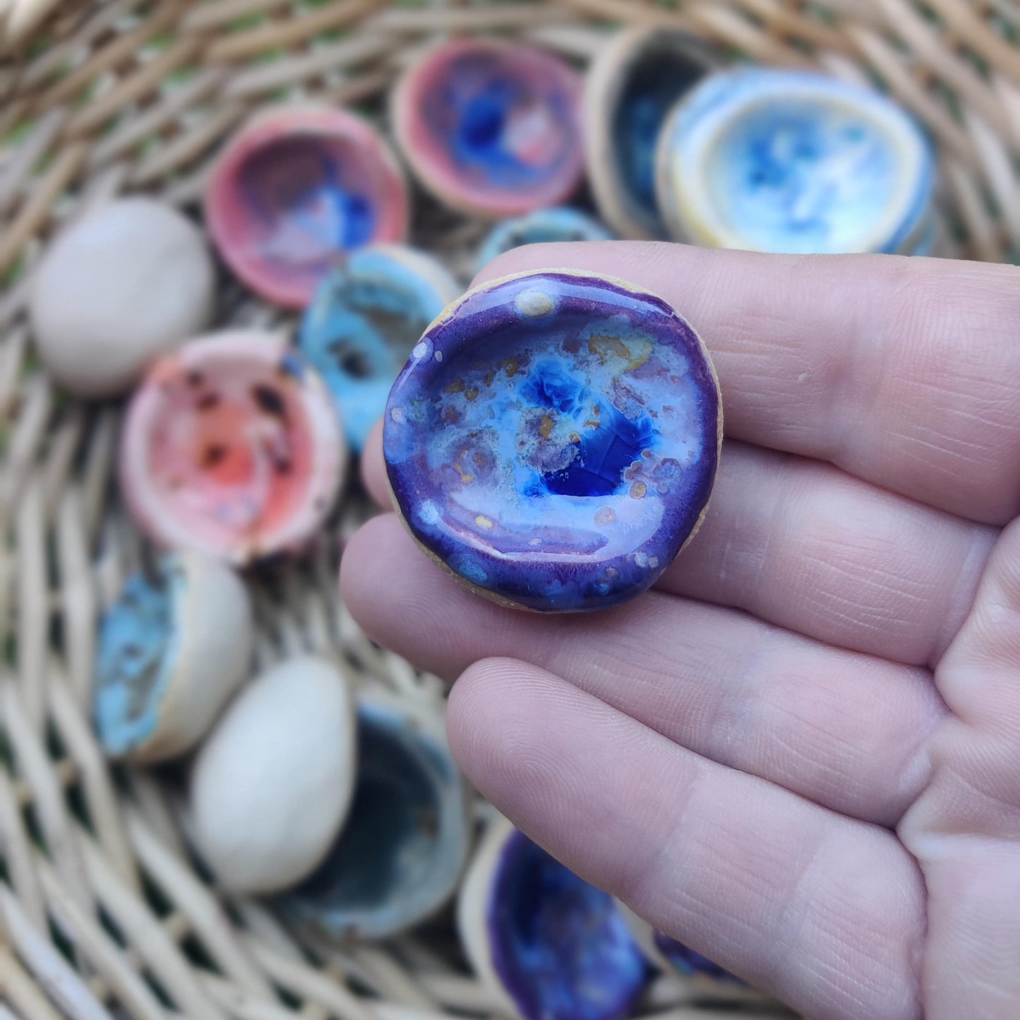 Handmade ceramic worry stone in a purple glaze, designed to support mindfulness and ease stress.
