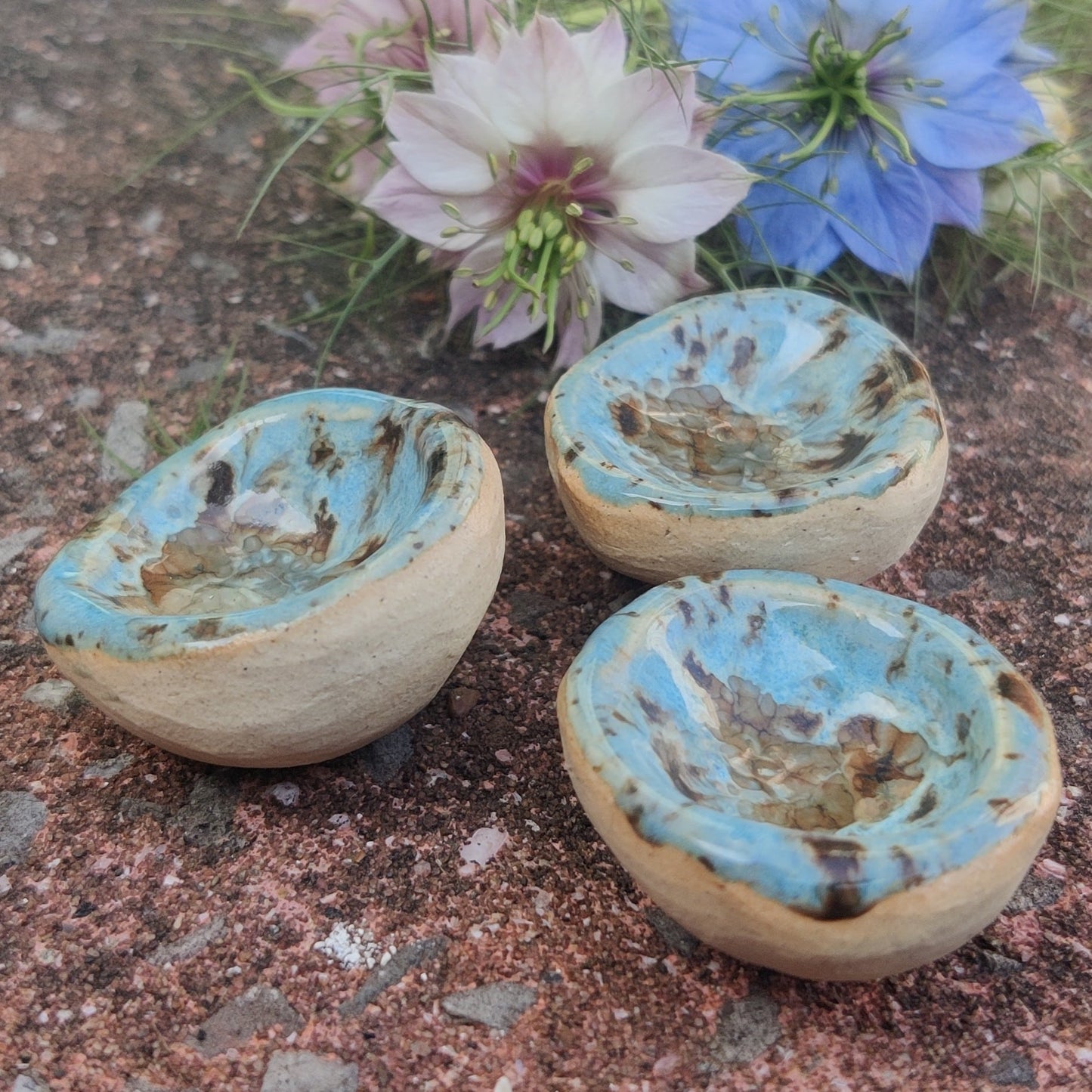 Handmade ceramic worry stone in a blue yellow glaze, designed to support mindfulness and ease stress.
