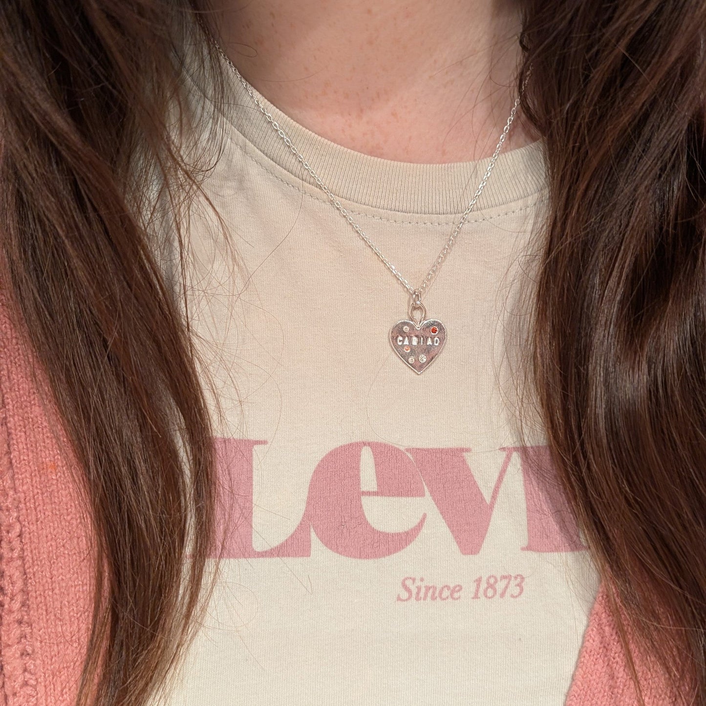 Cariad Welsh Heart Necklace displayed around the ladies neck, handmade in Wales, perfect Christmas or Valentine’s Day present