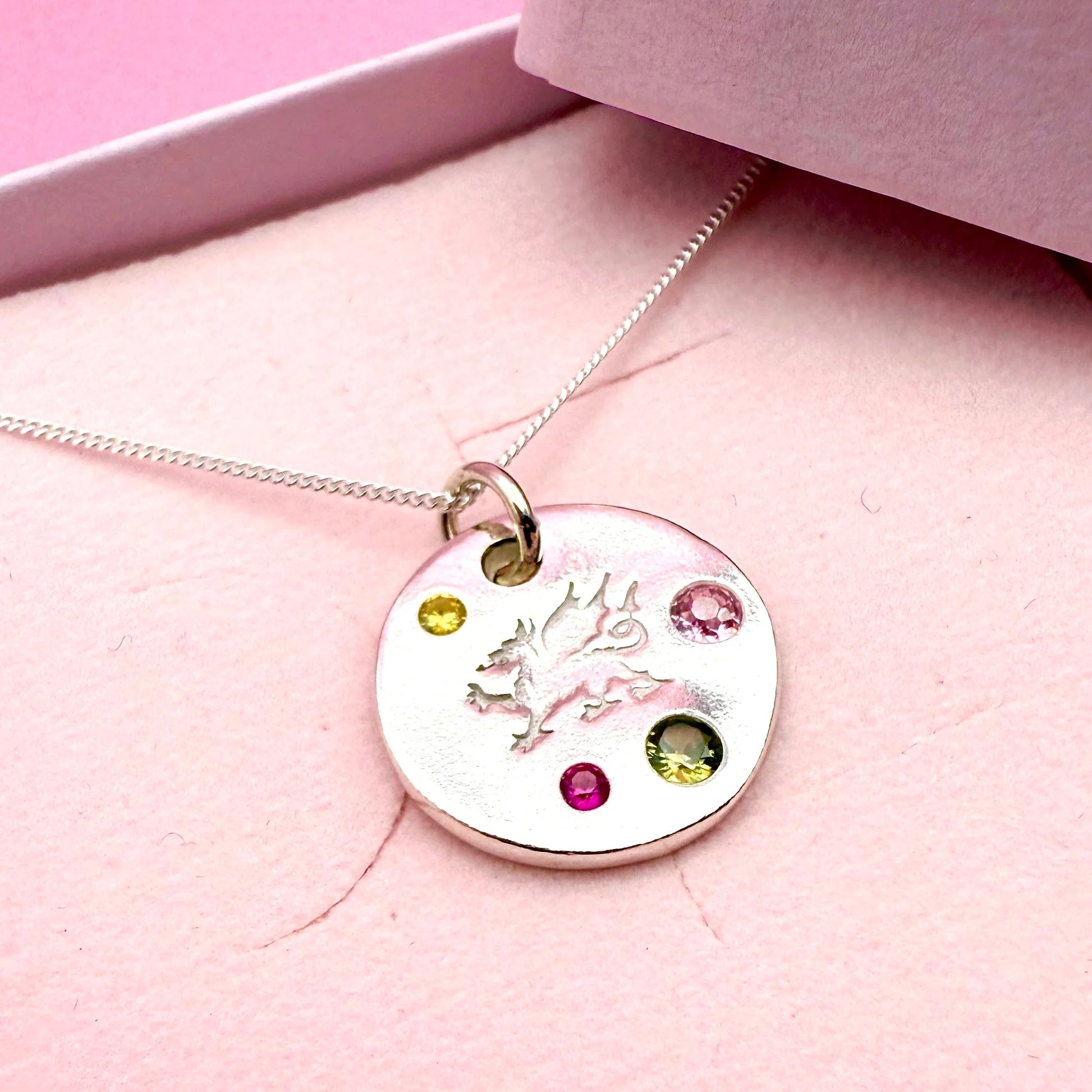 Handmade silver Welsh dragon necklace with colourful gemstones, crafted in Wales.