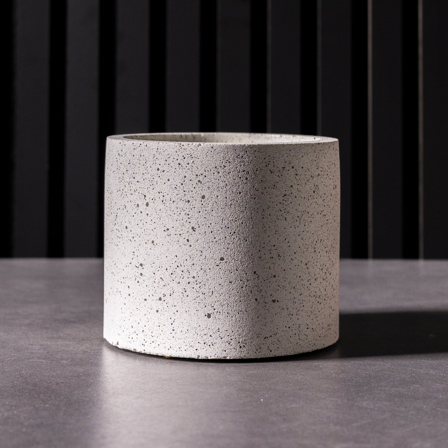 Close-up of unique white cement effect handmade plant pot with one-of-a-kind pattern, made in Wales, ideal for indoor plants or stylish storage