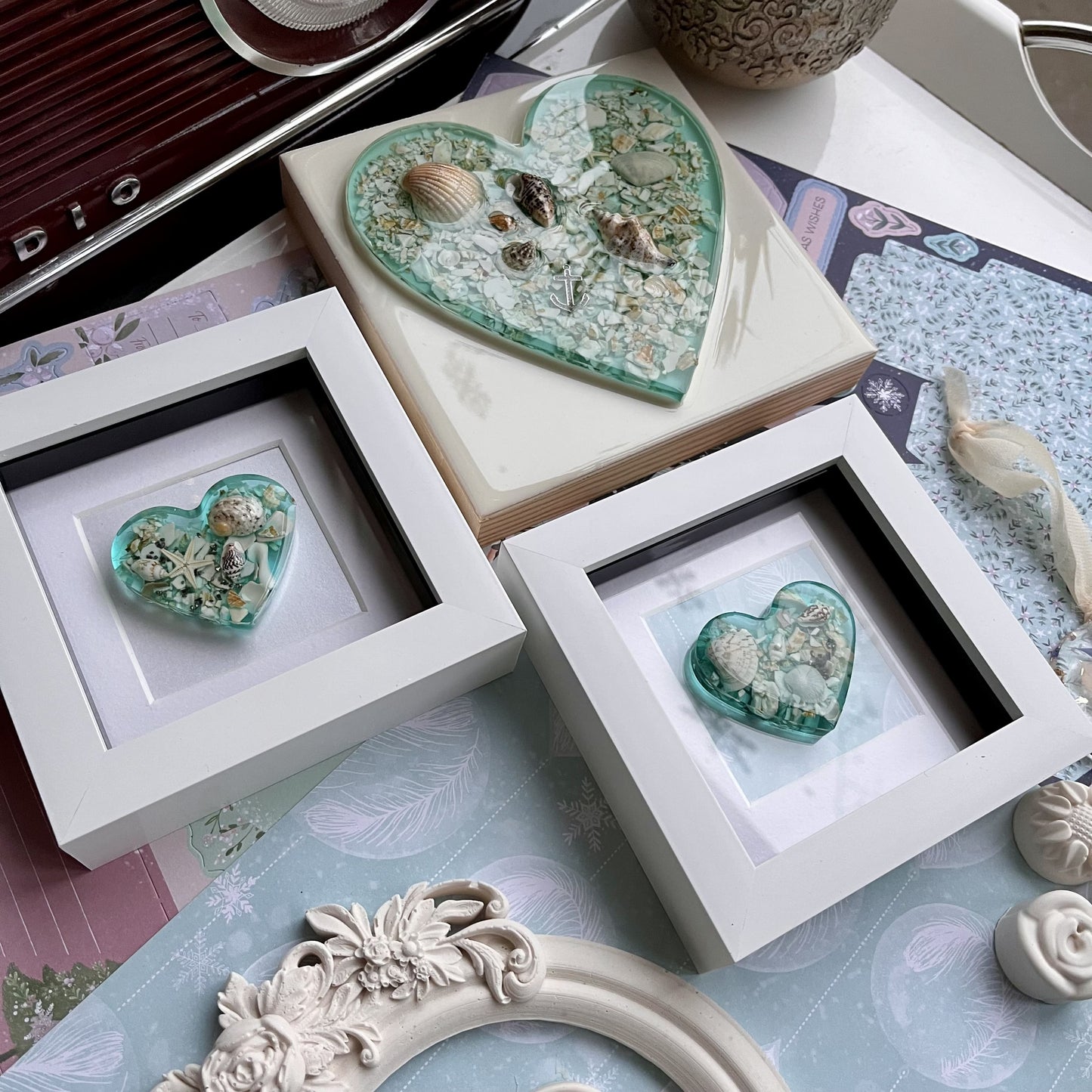 Ocean-inspired resin heart artwork in white frame