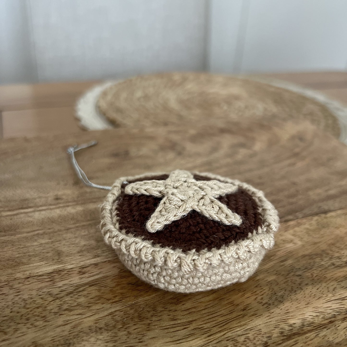 Crocheted Christmas mince pie ornament in warm, festive colours, handmade in Wales