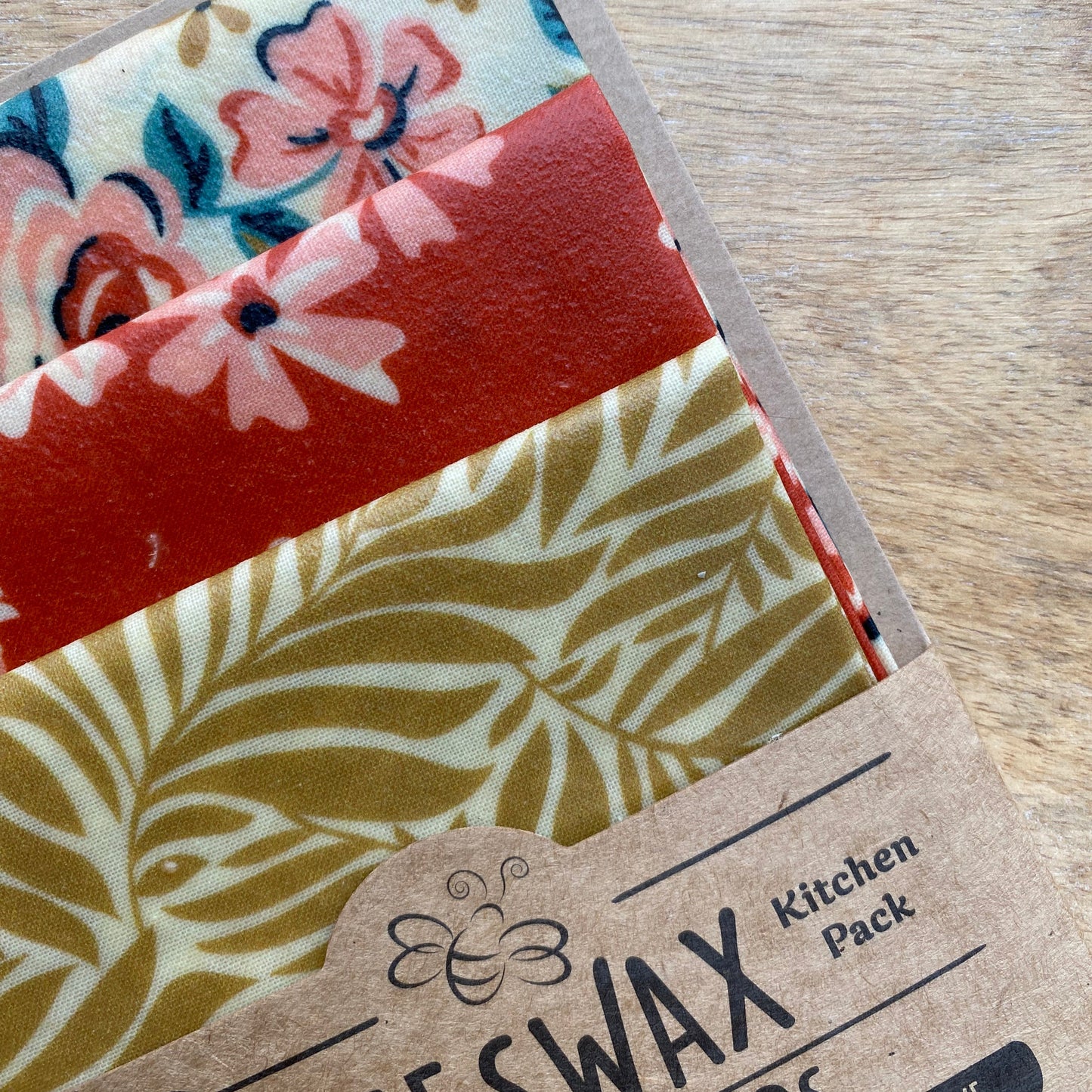 Eco-friendly reusable kitchen wrap with bold floral printed fabric, handmade in Wales