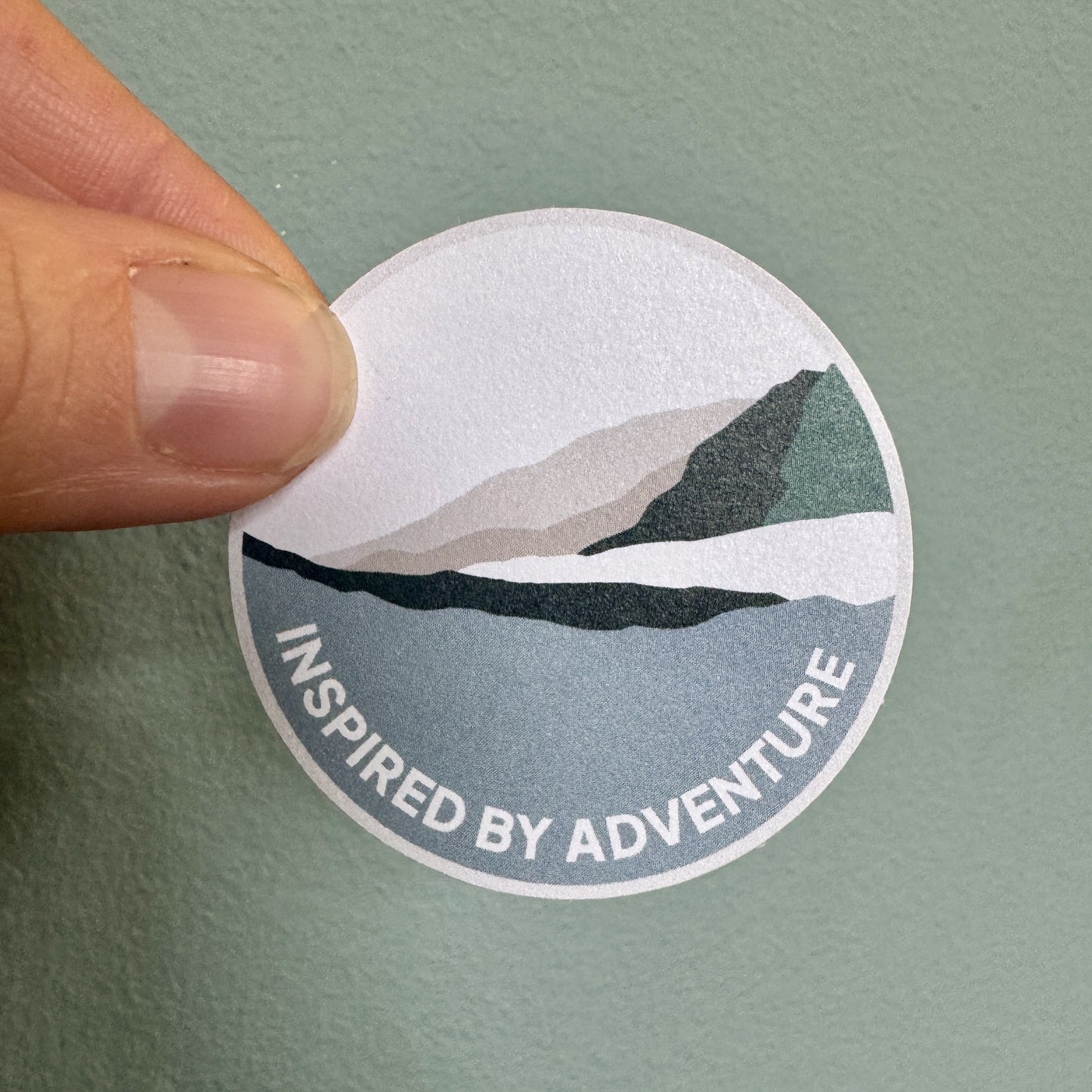 Inspired by Adventure mountain sticker – eco white vinyl outdoor-themed circle sticker