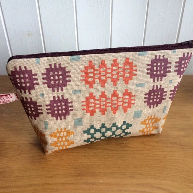 Handmade Welsh tapestry wash bag with zip closure and cotton lining.