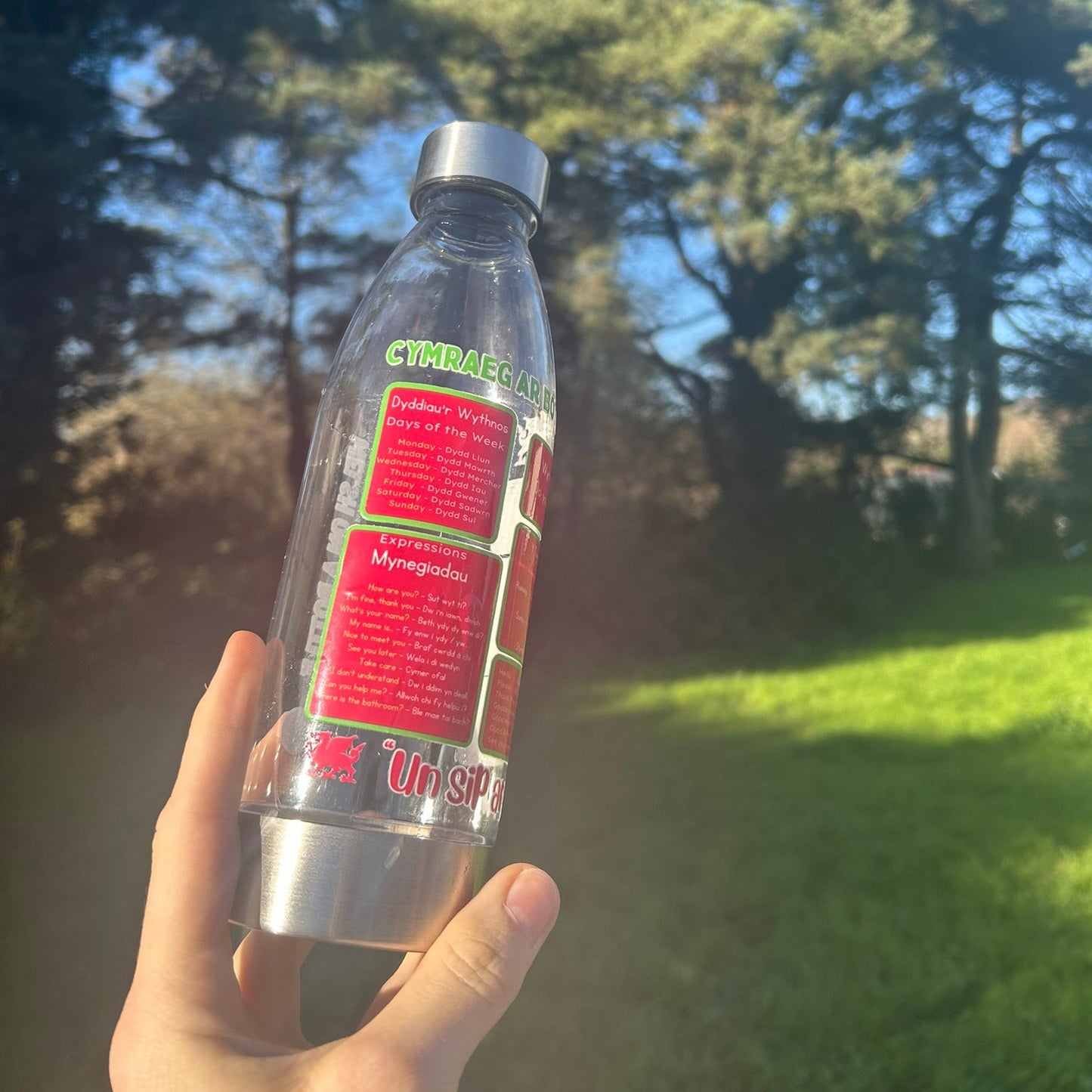Sustainable reusable bottle featuring Welsh words and motivational quote, perfect for Welsh learners, made in Wales.