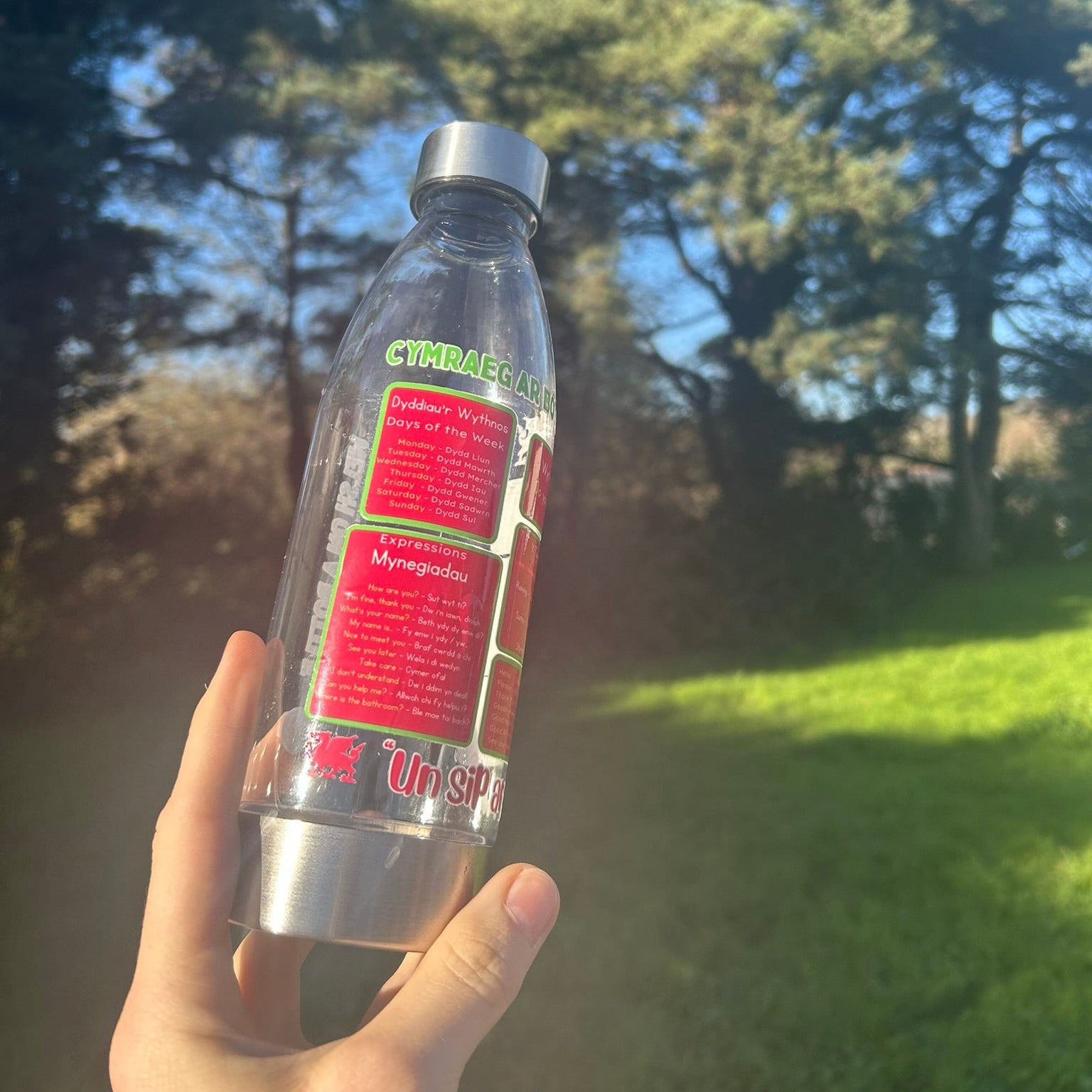 Sustainable reusable bottle featuring Welsh words and motivational quote, perfect for Welsh learners, made in Wales.