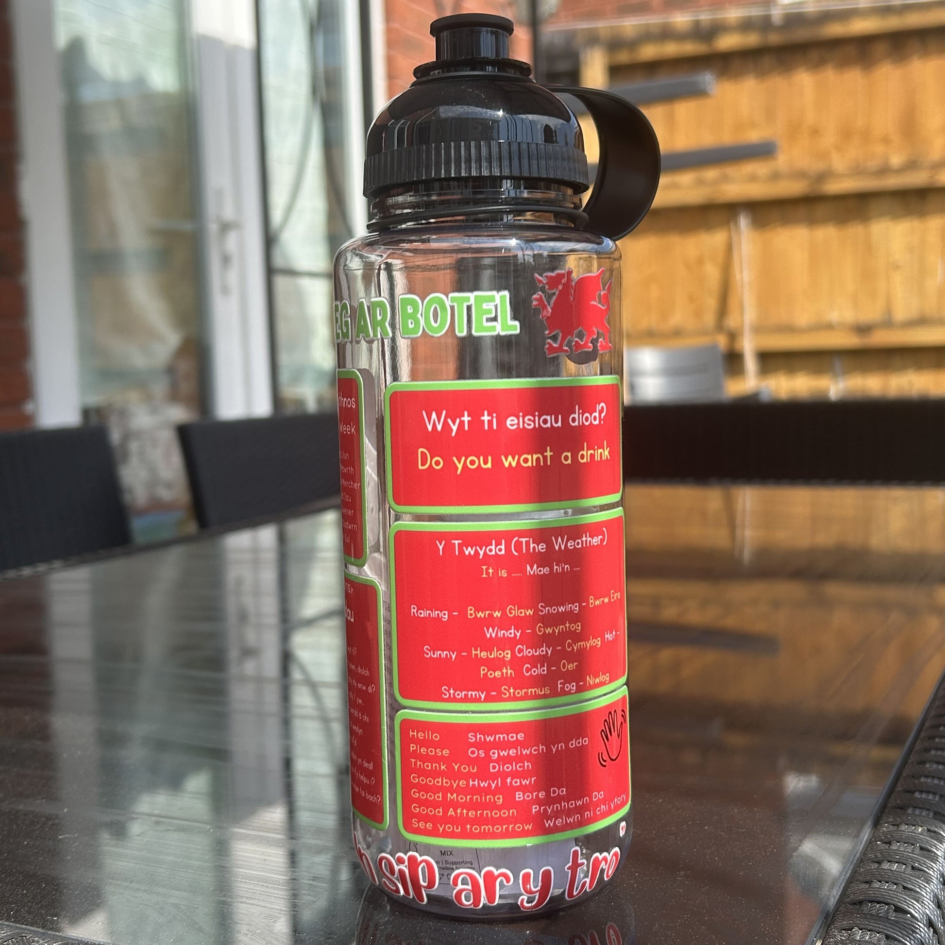 Sustainable reusable water bottle featuring Welsh words and motivational quotes. Perfect gift, made in Wales