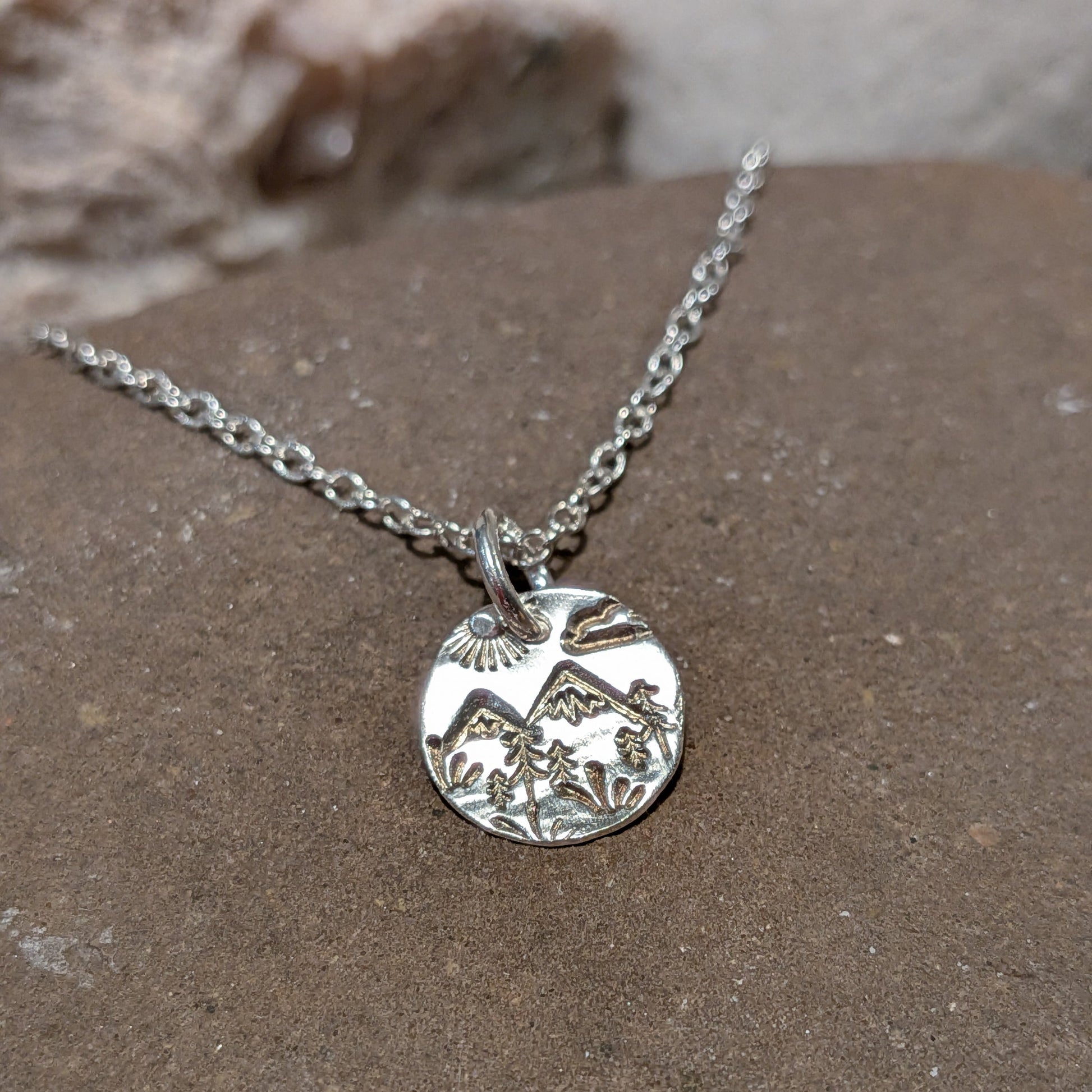 Brynniau silver hill scene necklace handmade in Wales with trees, sun, cloud and grass. made in wales, landscape jewellery, gifts for her.