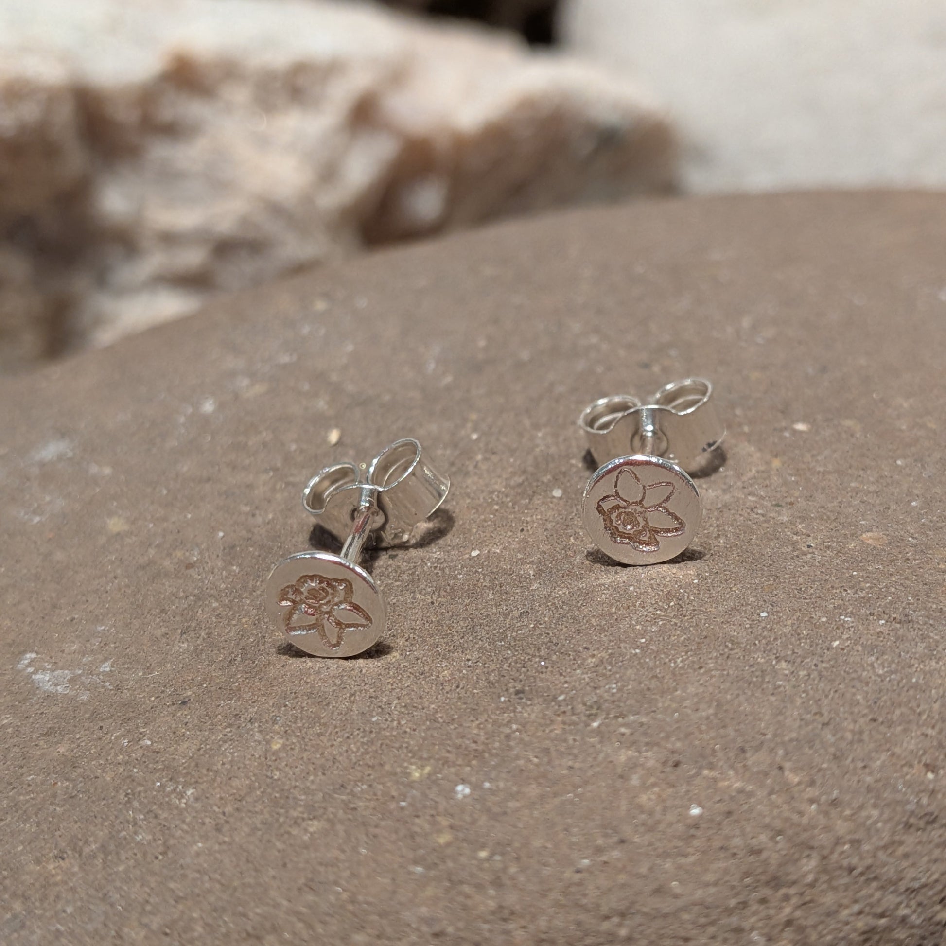 Small recycled sterling silver daffodil stud earrings handmade in Wales