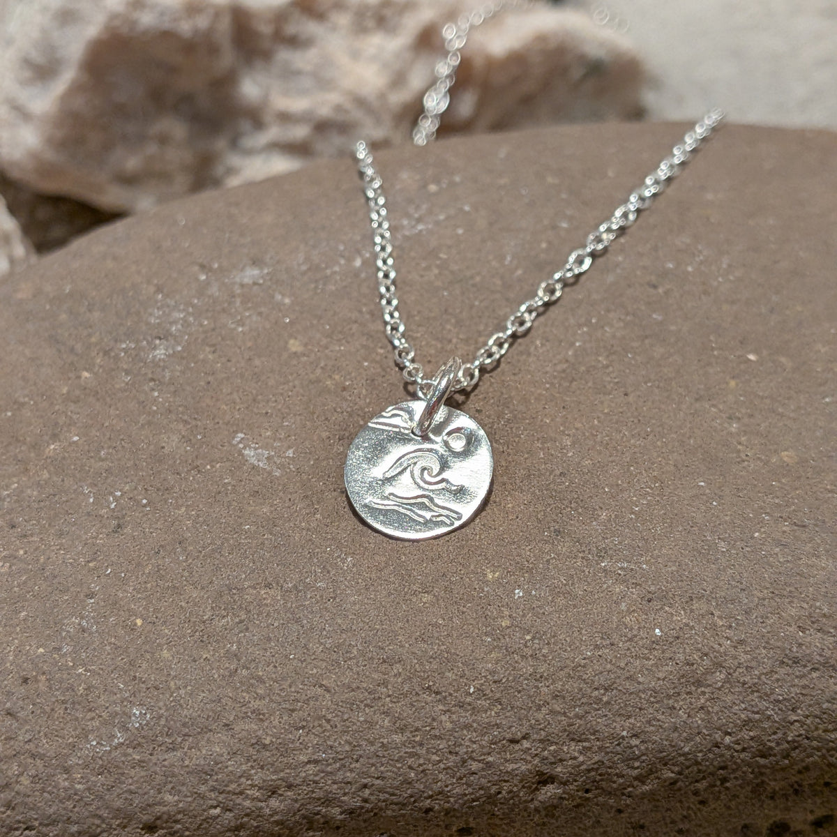 Recycled sterling silver disc pendant necklace featuring Welsh wave sun and sea scene by Welsh jeweller, small business owner. perfect gift for her for christmas.