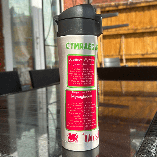 Eco-friendly stainless steel Welsh flask showing Welsh learner phrases, days, weather and expressions