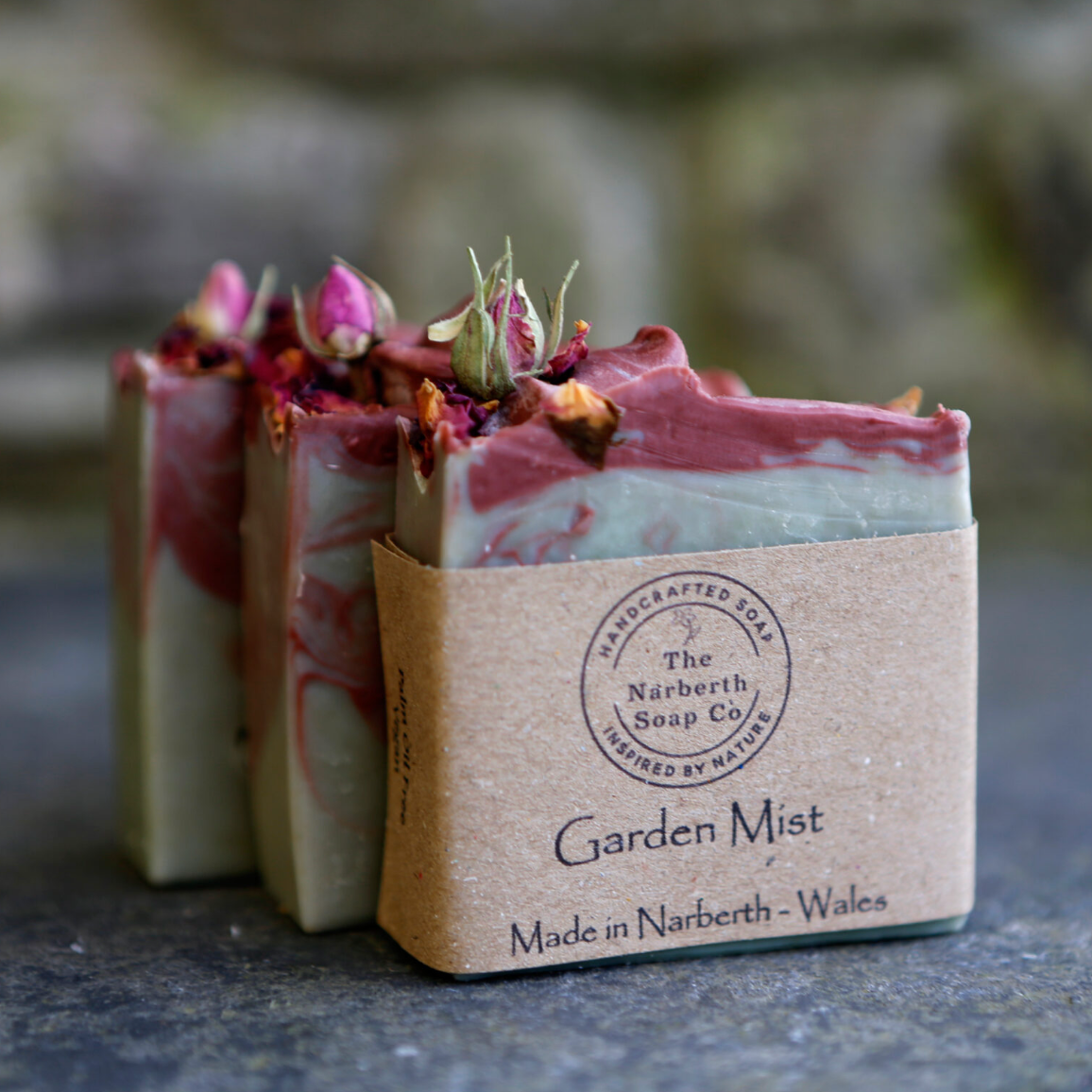 Close up of Garden Mist soap bar showing natural essential oil blend for calming skin nourishing benefits. Made in Wales, perfect gift for a loved one or to treat yourself.