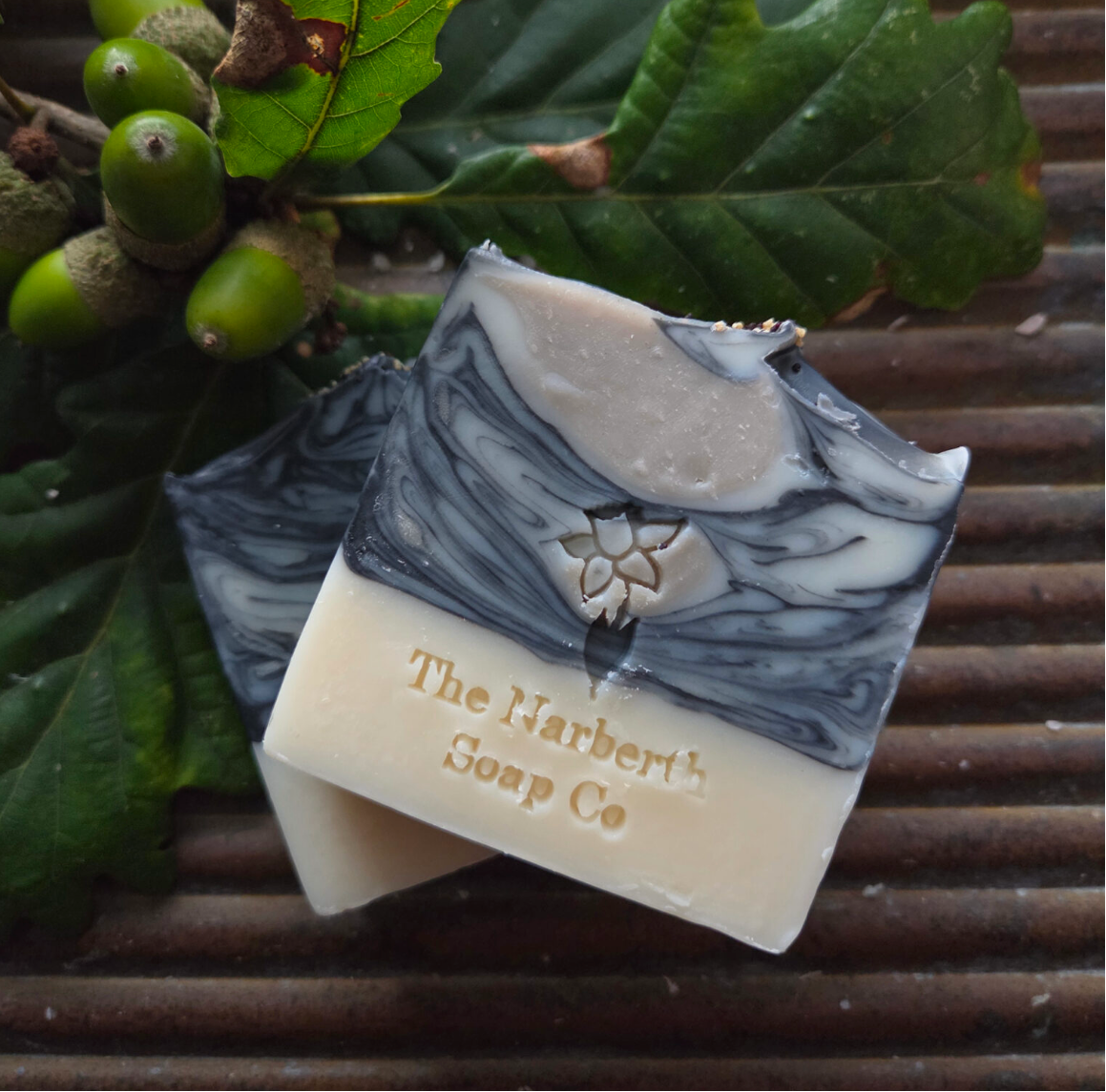 Close up of Gathering Storm soap bar with blue Serbian clay, activated charcoal and poppy seeds for gentle exfoliation. Makes the perfect Christmas gift for loved ones.