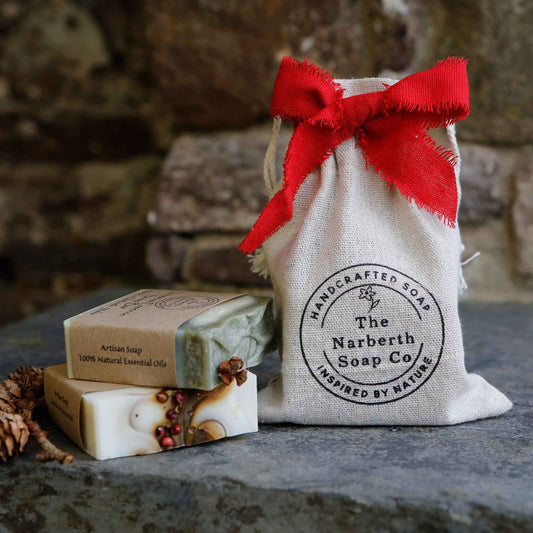 Handmade Welsh soap gift set with two artisan soaps in a reusable cotton bag, ready to gift, made in Wales, perfect for Christmas presents. 