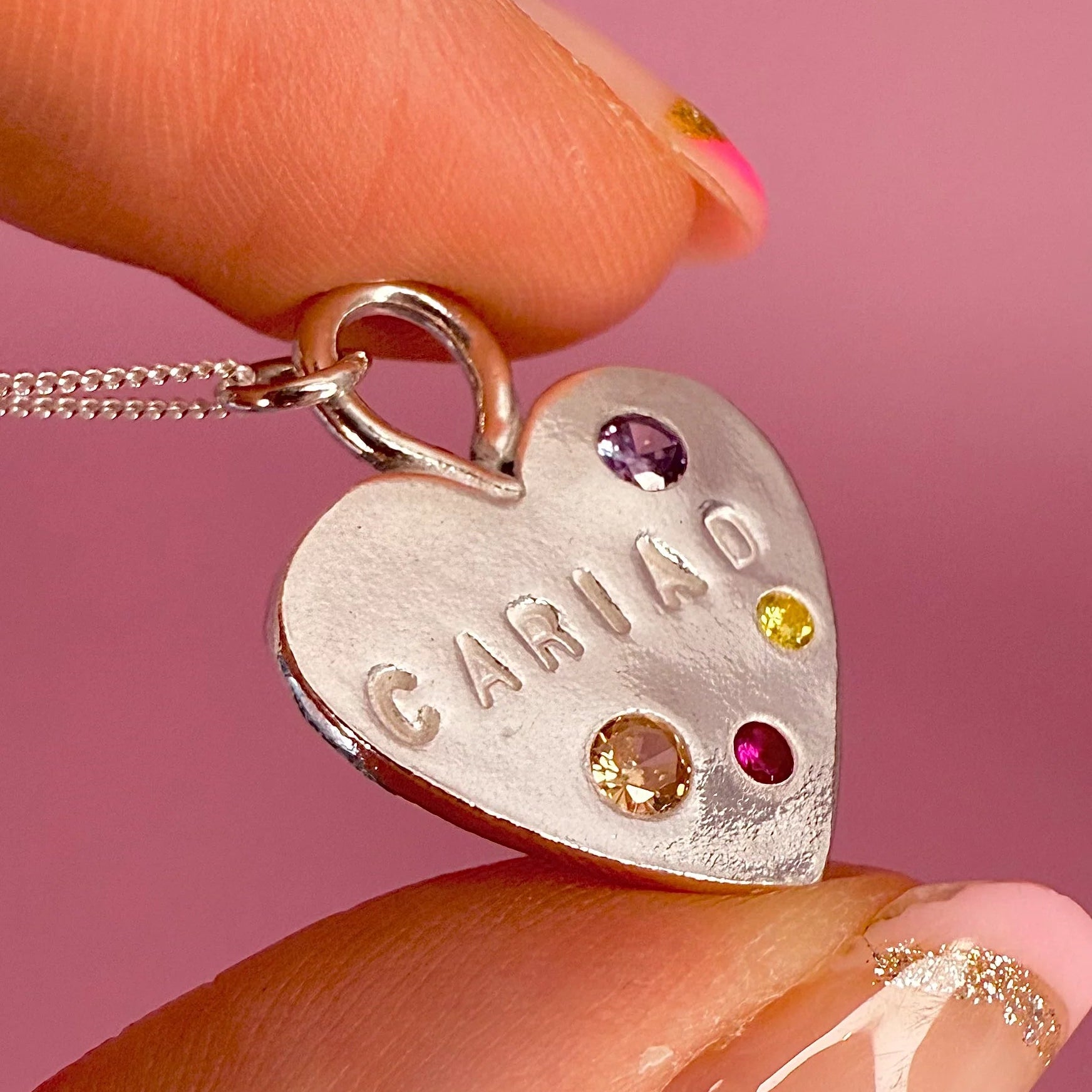 Unique handmade Welsh heart necklace in fine silver with coloured gemstone details, meaningful Welsh gift for her