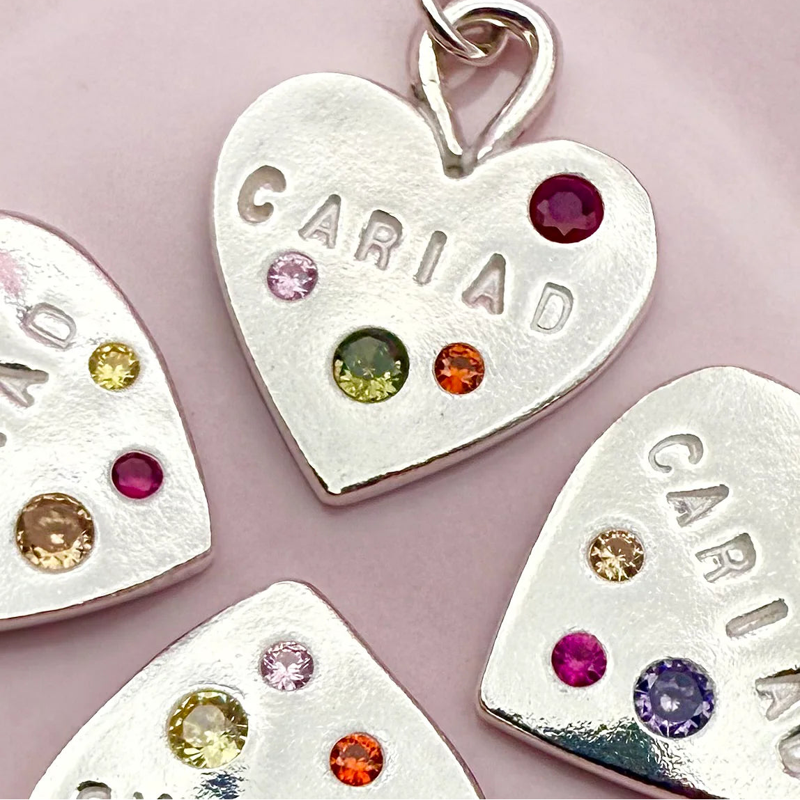 Unique handmade Welsh heart necklace in fine silver with gemstone details, meaningful Welsh gift for her