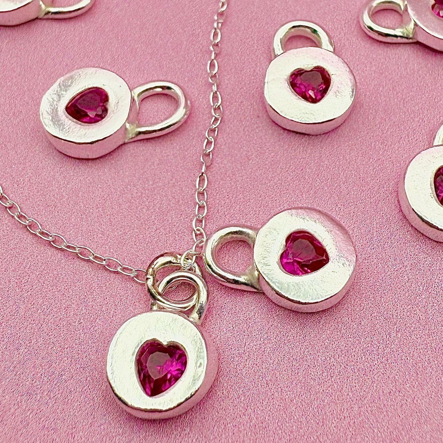 Handmade Jammie Heart Charm Necklace in silver with ruby cubic zirconia, perfect gift made in Wales.