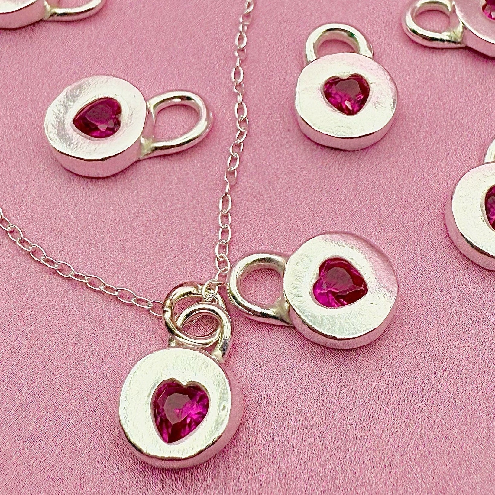 Handmade Jammie Heart Charm Necklace in silver with ruby cubic zirconia, perfect gift made in Wales.