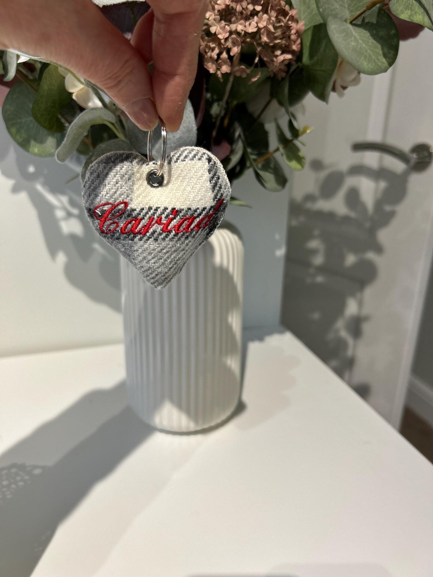 Handmade heart-shaped plaid keyring with 'Cariad' embroidered.unique Welsh textile gift accessory for birthdays, Christmas, weddings