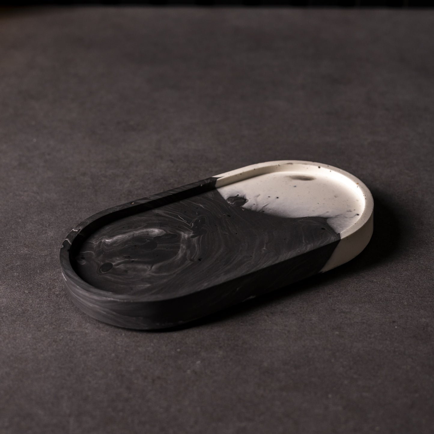 Black and white marbled oval Jesmonite trinket trays in different colours, handcrafted in Wales, perfect for gifting or home décor