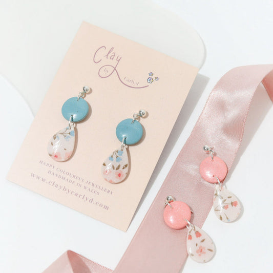 Delicate floral resin teardrop earrings showcasing pink and blue flowers, perfect for enhancing your jewellery collection and ideal for those who love handmade accessories and unique gifts.