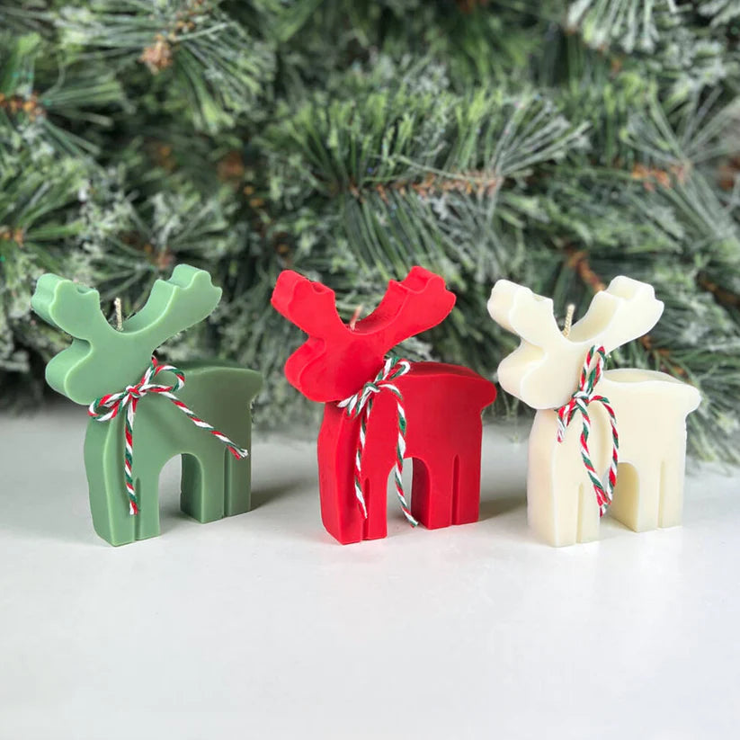 Festive Christmas candle shaped like a reindeer, ideal for gifting