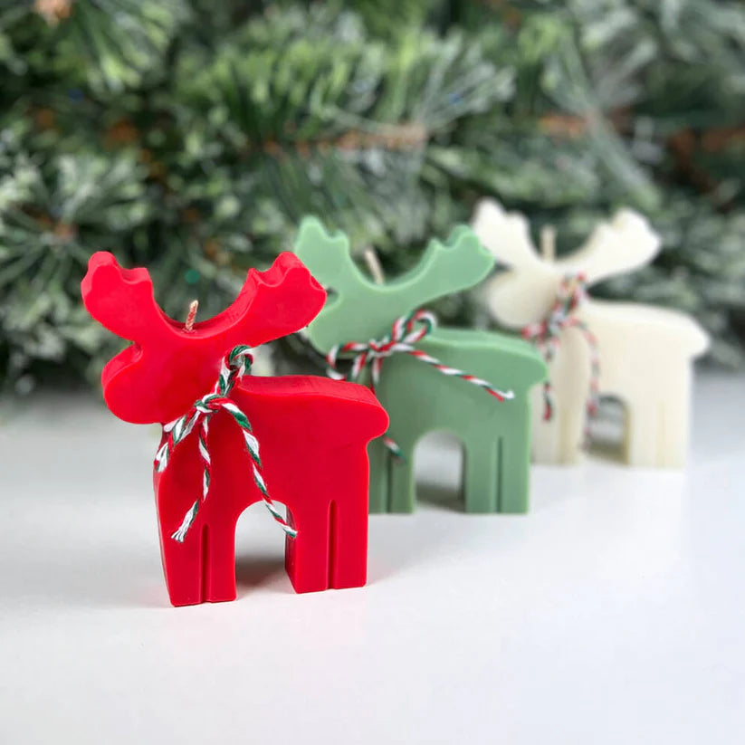Handmade reindeer candle in pastel colours for Christmas décor