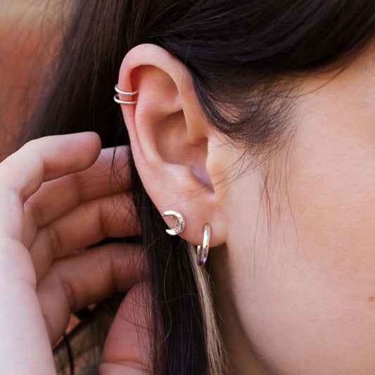 Sustainable recycled sterling silver ear cuff on models ear