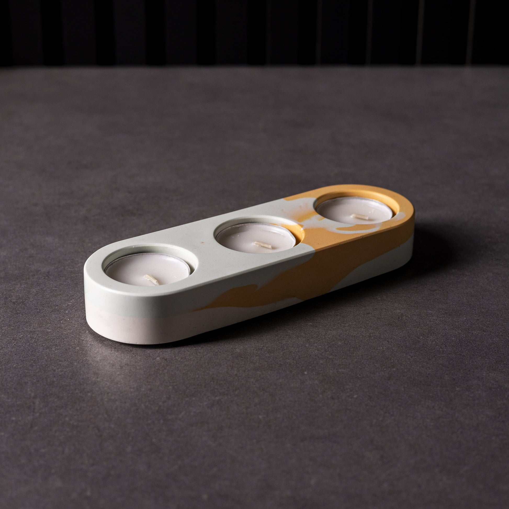 Handmade white and orange marbled Jesomite triple tealight candle holder in vibrant from Wales