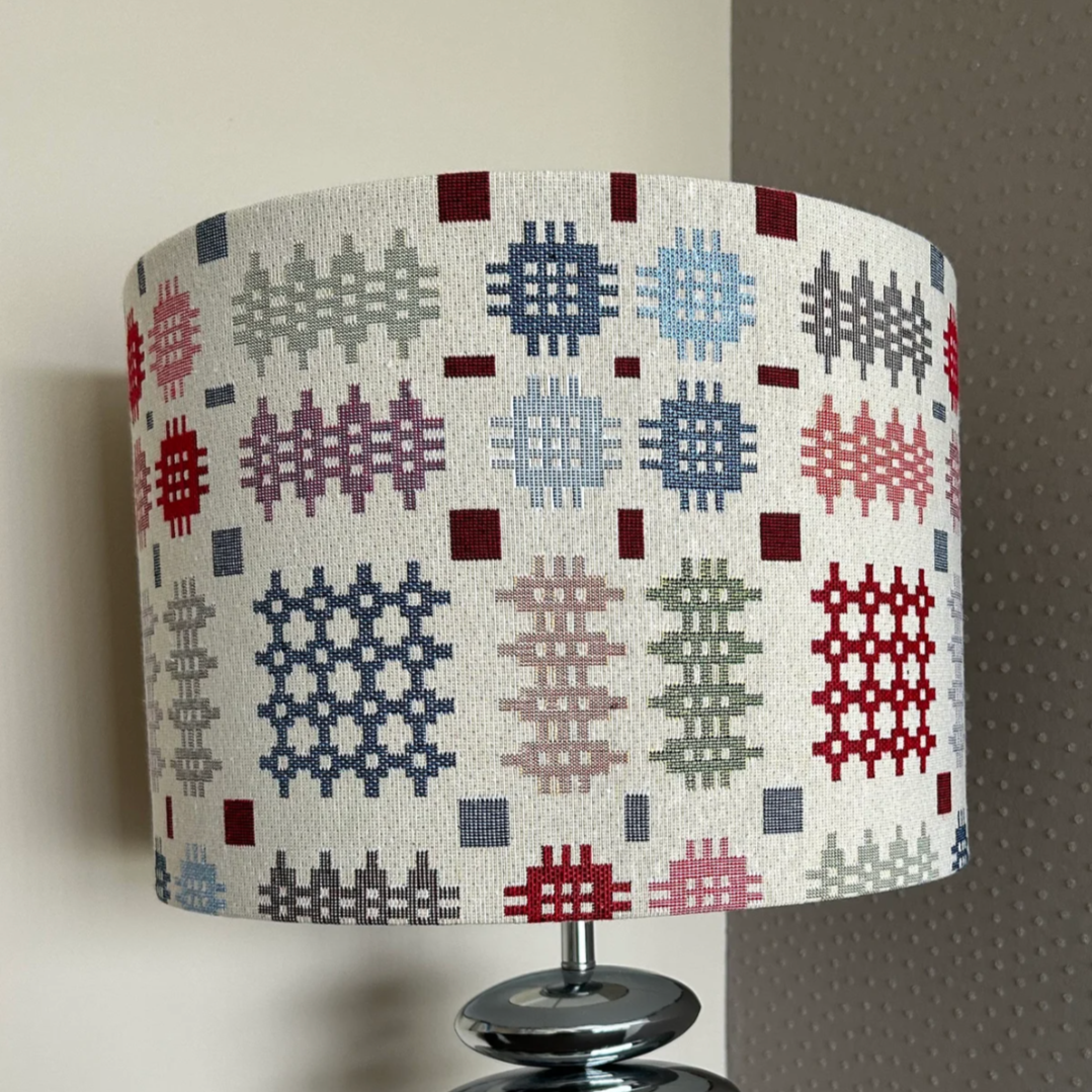 Handmade Welsh tapestry lampshade with vibrant traditional fabric, suitable for pendant, table, or floor lamps.