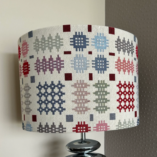 Handmade Welsh tapestry lampshade with vibrant traditional fabric, suitable for pendant, table, or floor lamps.