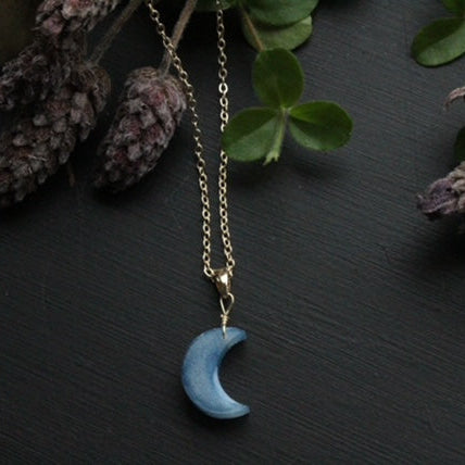 Handcrafted bio resin crescent moon necklace with black and white marbled pendant