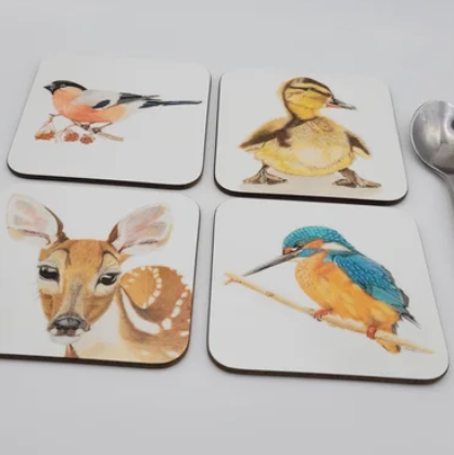 Set of four coasters with animal illustrations on a white surface. Nature inspired bird and animal coaster, gift for wildlife lover.
