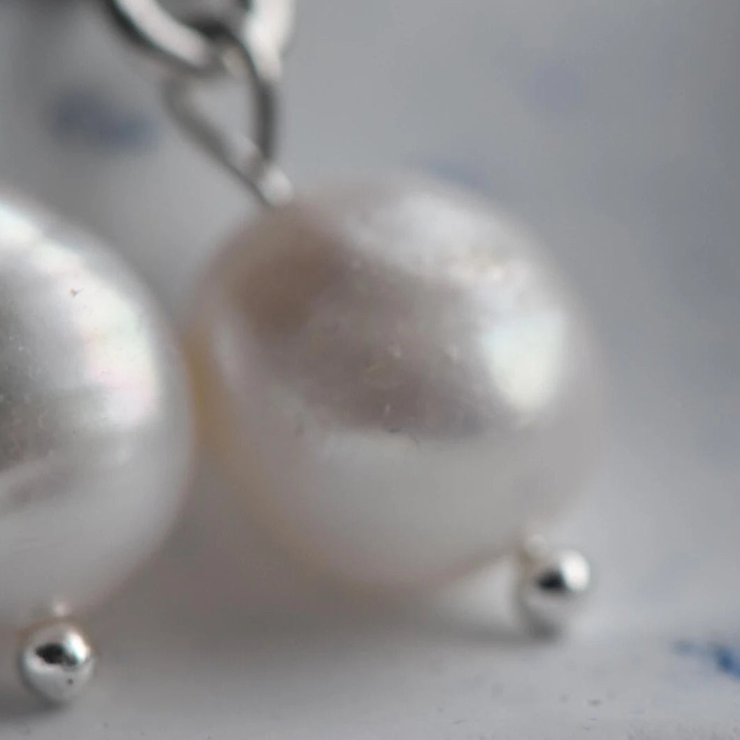 Elegant freshwater pearl drop earrings with clear crystal stud”