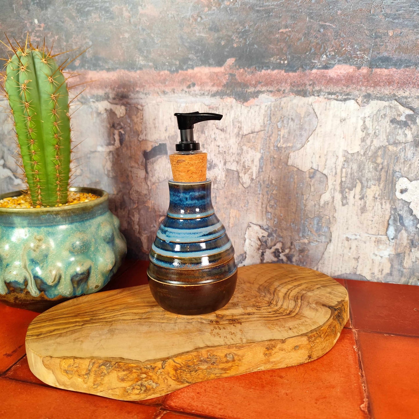 Artisan pottery soap pump with blue and umber glaze, handmade in Wales
