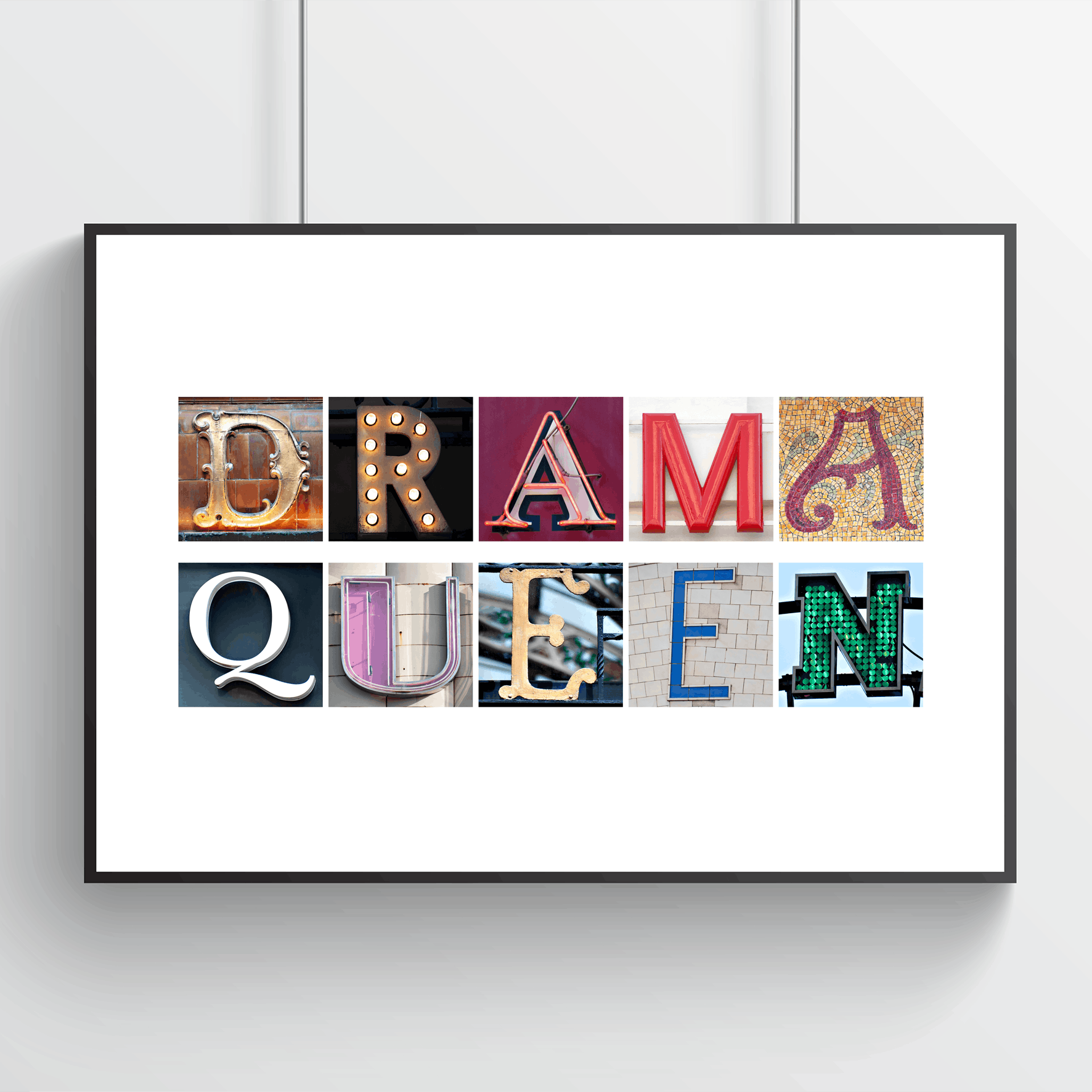 Framed artwork with colourful letters spelling 'Drama Queen' on a white background. Quirky Drama Queen wall art from independent artist in Wales.