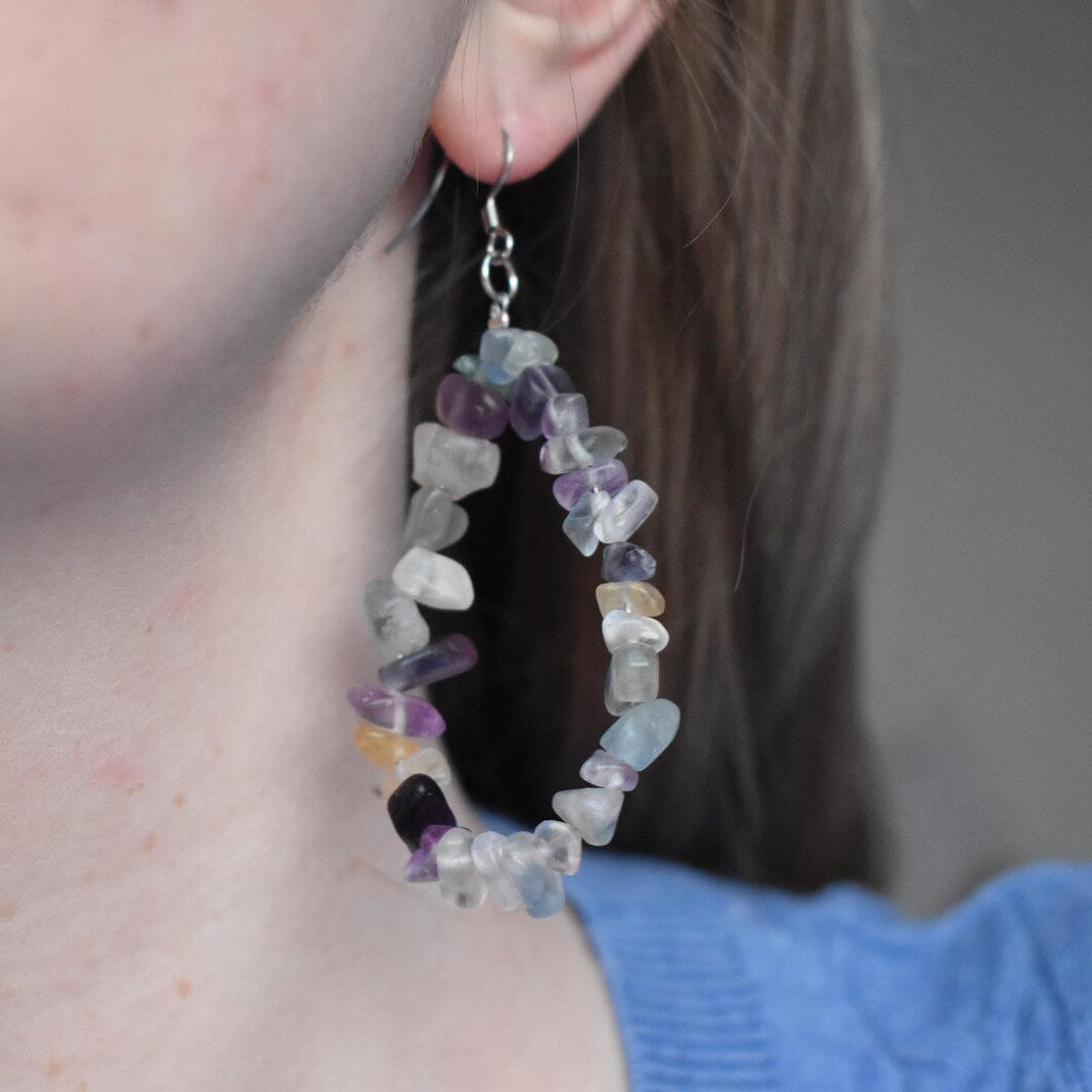 Close-up of a person wearing colourful Natural fluorite crystal drop earrings handmade jewellery