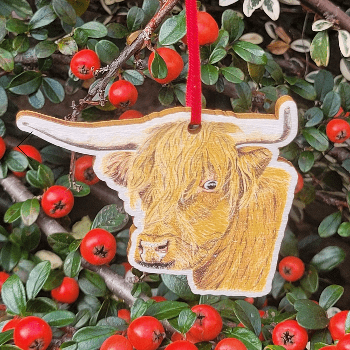 Handcrafted Highland cow wooden Christmas ornament with red ribbon, sustainable wood, made in Wales