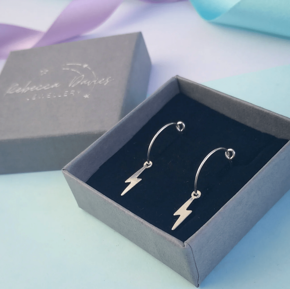 Sterling silver lightning bolt hoop earrings, handmade in Wales, minimalist statement jewellery gift