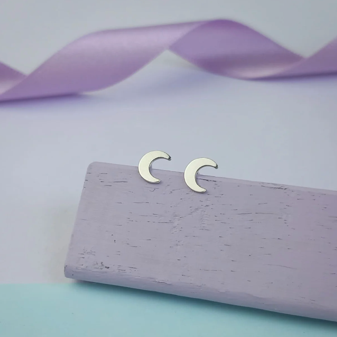 Dainty sterling silver moon stud earrings handmade by a Welsh maker – perfect gift for her and ideal for shopping small this Christmas.
