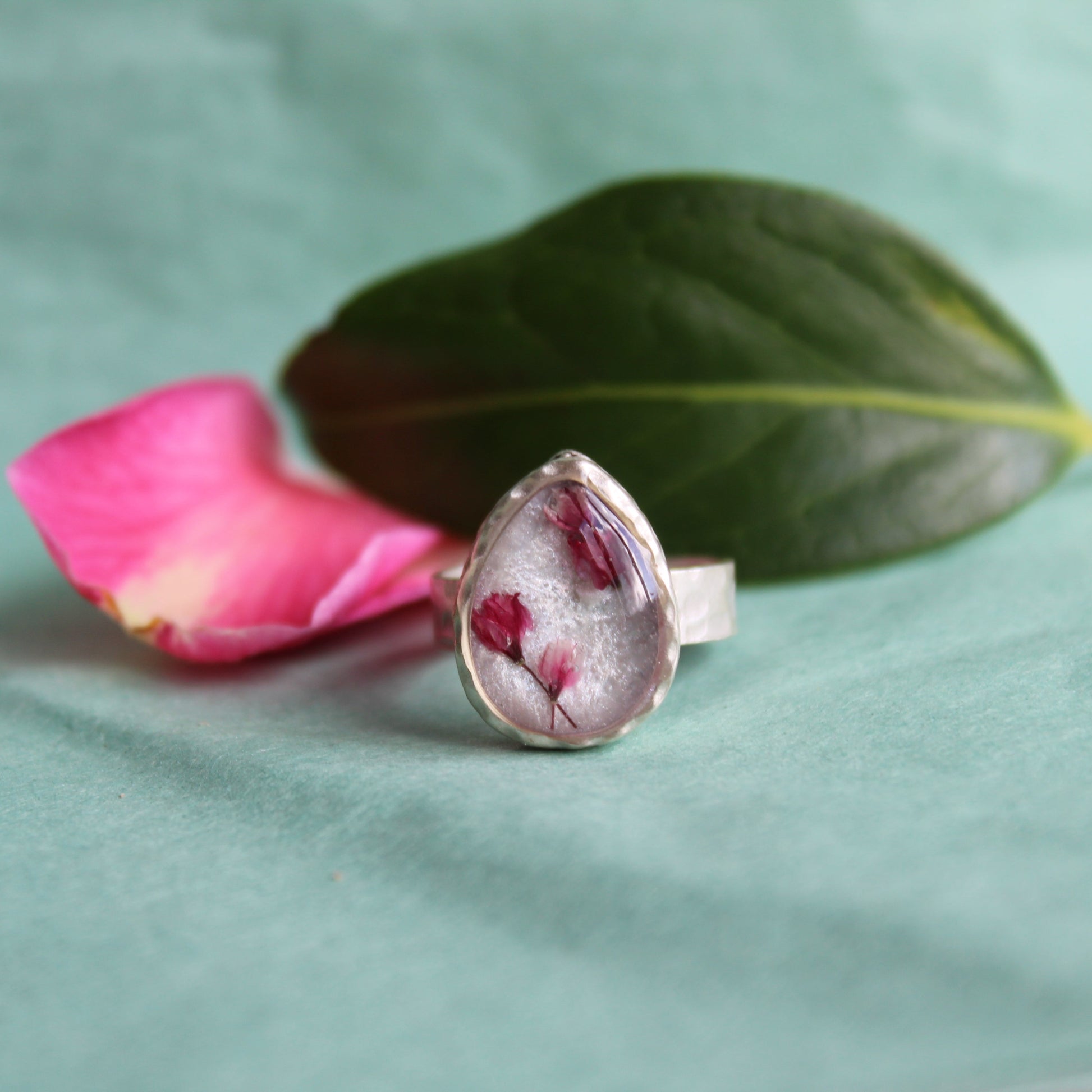 Hammered silver-plated adjustable ring with Japanese blossom resin design. Made in Wales.