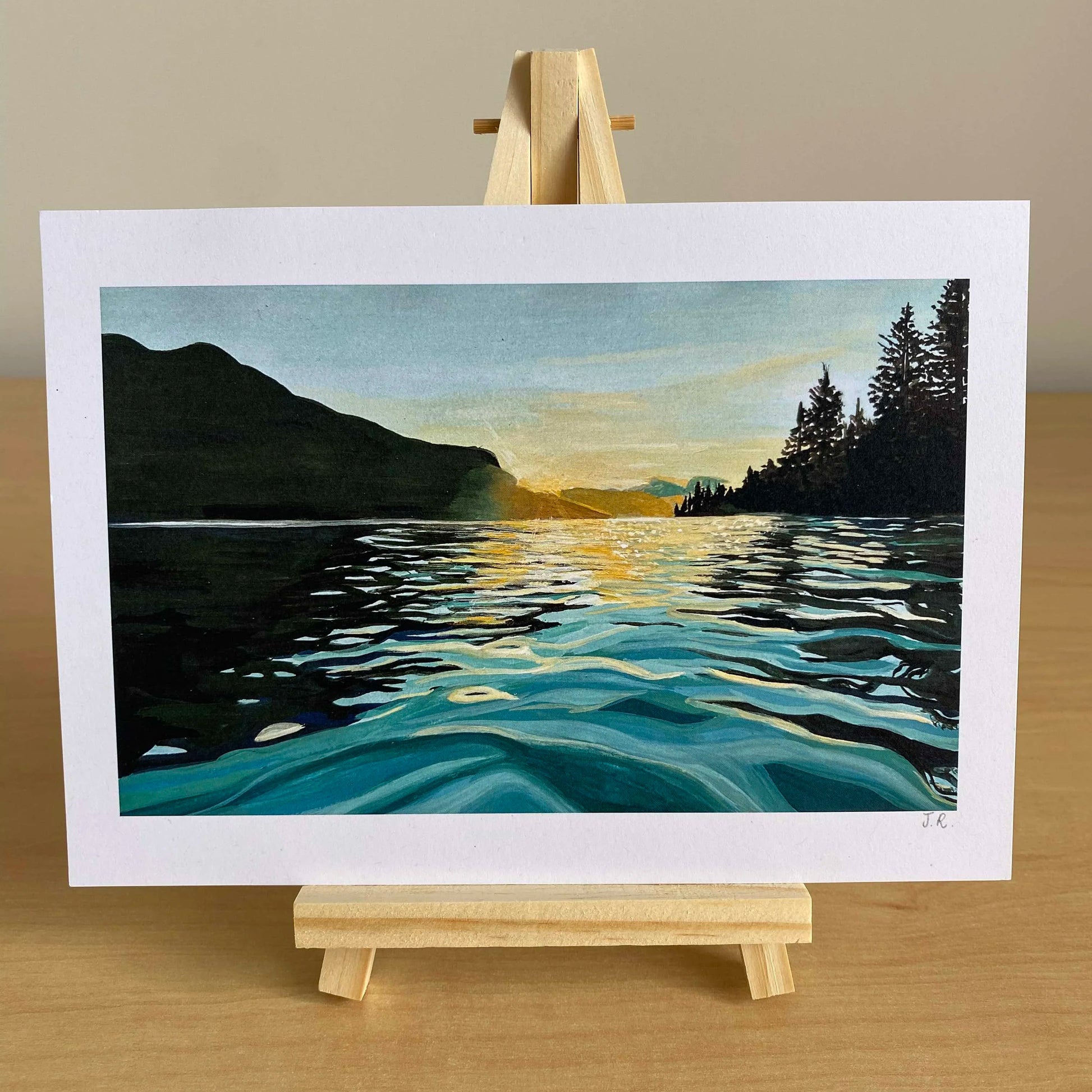 Art print of a sunset over a lake with mountains and trees, wall art for peaceful home décor, made in Wales.