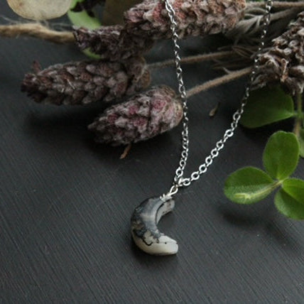 Handcrafted bio resin crescent moon necklace with black and white marbled pendant