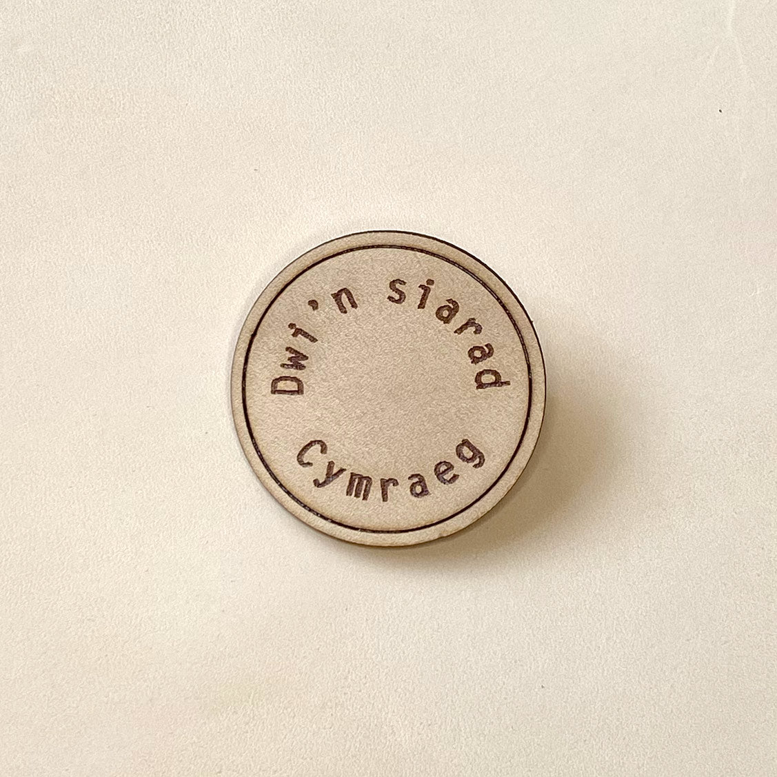 Handmade Cymraeg leather brooch for Welsh speakers